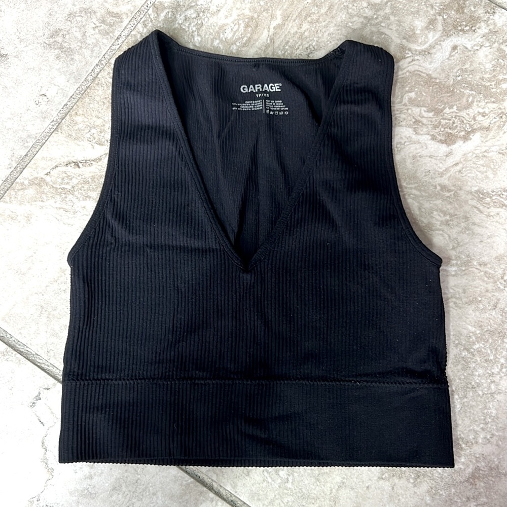 Garage cropped black V neck ribbed tank. Size XS.